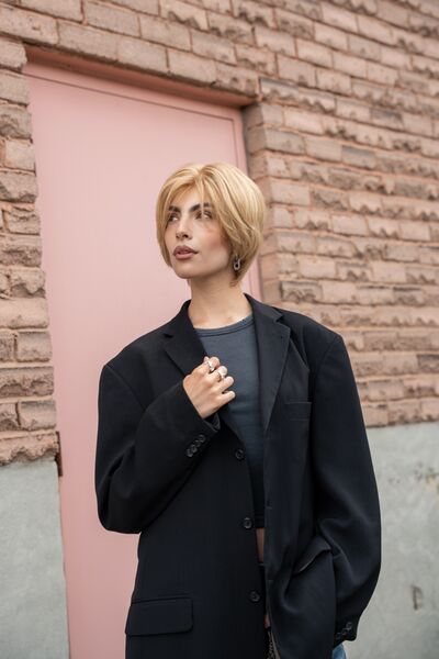 Model wearing the EULISSE European virgin hair wig, golden pixie bob