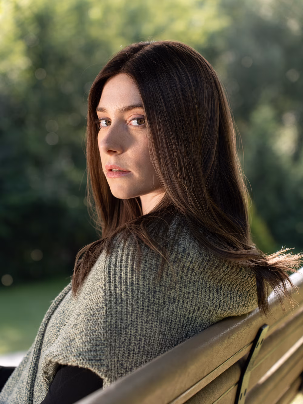 Esther kosher sheitel in Roasted Almond, seated outdoors