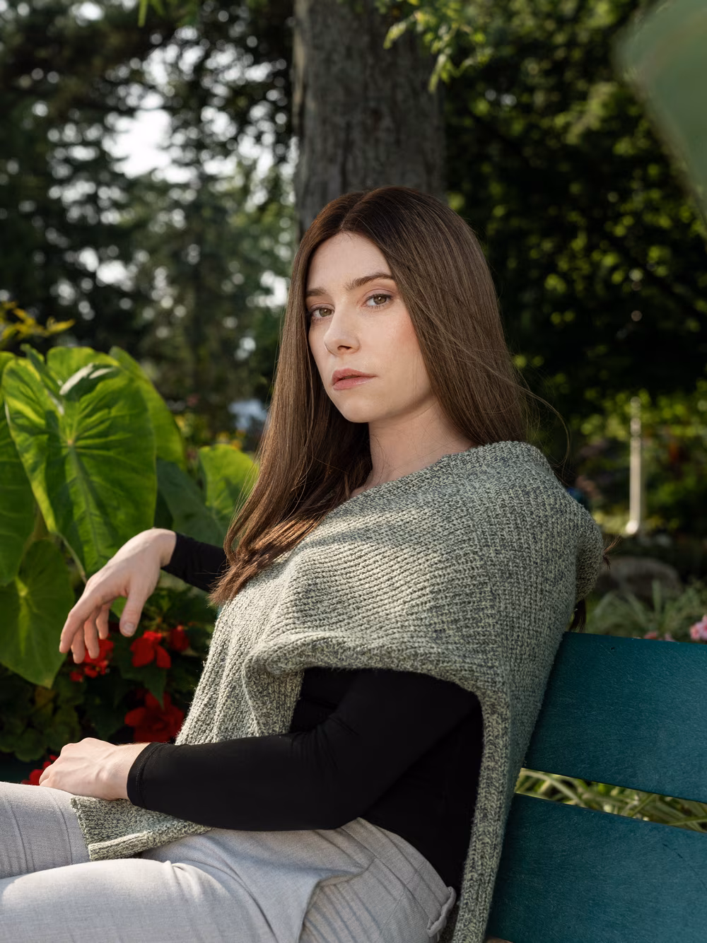 Esther kosher sheitel in Roasted Almond photographed in a garden